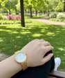 Elegant Gold-Tone Women’s Wristwatch – Crystal Roman Dial & Textured Bracelet Design